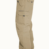Turbine FDGB Shell Pant 2021 - A pair of khaki-colored pants with a zippered pocket on the thigh and a small logo patch near the waistband.