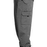 Turbine FDGB Shell Pant 2021 - A pair of gray pants with a red logo on the upper right pocket.