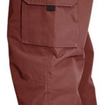 Turbine FDGB Shell Pants 2024 - A pair of brown pants with a zippered pocket on the thigh and a small red logo above it.
