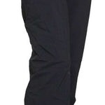 Turbine Women's Aura II Shell Pant 2023 - Black snow pants with a zippered pocket on the right thigh and adjustable Velcro straps at the waist.