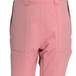 Turbine Ladies Longtrail Bib Pants 2024 - A pair of pink snow pants with black accents on the straps and a small logo patch near the front waistband.