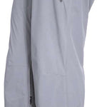 Turbine Women's Siren Shell Pant 2023 - Black pants with a subtle white snowflake pattern on the left leg, featuring a zippered pocket and adjustable waistband.