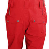 Turbine Mission II Bib Pants 2024 - Red bib pants with black trim and silver hardware, featuring a snow-covered mountain landscape in the background.