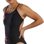 TYR Women's Cutoutfit Torch Swimsuit - A black swimsuit with a red and orange flame design on the left side, featuring cutouts along the sides.
