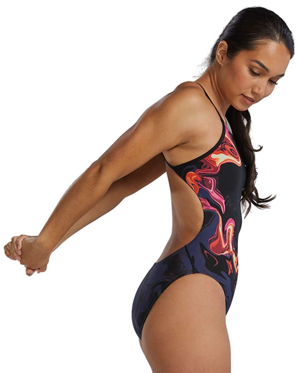 TYR Women's Cutoutfit Torch Swimsuit - A black swimsuit with a vibrant, abstract red and orange design on the torso area.