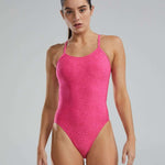 TYR Ladies Lapped Cutoutfit Suit - A women's one-piece swimsuit with a lapped cutout design on the hips, featuring a solid black color and thin straps.