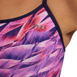 TYR Women's Trinifyfit Falcon Swimsuit - A pink and purple swimsuit with a pattern of abstract shapes resembling feathers or wings.