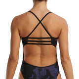 TYR Women's Trinityfit Torch Swimsuit - A black one-piece swimsuit with a red and orange abstract pattern on the sides.