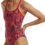TYR Women's Crystalized Cutout Swimsuit - A red swimsuit with a geometric pattern and cutouts on the sides, featuring a white logo near the top center.