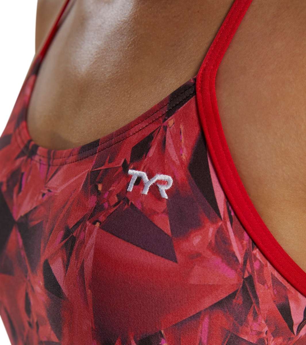TYR Women's Crystalized Cutout Swimsuit - A red swimsuit with a geometric pattern and cutouts on the sides, featuring a white logo that says "TYR" in the center of the chest area.