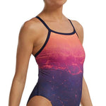 TYR Women's Diamondfit Infrared Swimsuit - A pink and black one-piece swimsuit with a high-cut leg and thin straps.