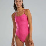 TYR Women's Lapped Trinityfit Swimsuit - A pink swimsuit with a lapped design, featuring thin straps and a high-cut leg.