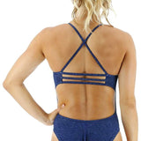 TYR Women's Lapped Trinityfit Swimsuit - A navy blue swimsuit with a textured pattern and thin straps that cross over at the back.