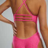 TYR Women's Lapped Trinityfit Swimsuit - A pink swimsuit with a lapped design and thin straps.