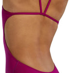 TYR Women's Solid Cutoutfit Swimsuit - A solid pink swimsuit with cutouts on the sides and a low back.