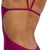 TYR Women's Solid Cutoutfit Swimsuit - A solid pink swimsuit with cutouts on the sides and a low back.