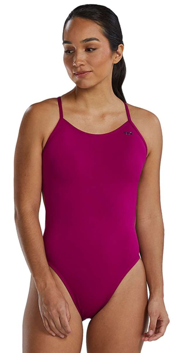 TYR Women's Solid Cutoutfit Swimsuit - A solid pink swimsuit with thin straps and a cut-out detail on the side.