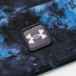 Under Armour - A blue, black, and white beanie with a tie-dye pattern.