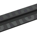 Union Boot Scraper Stomp Pad - Black stomp pad with a rectangular shape and rounded corners, featuring a flat top surface and a raised edge around it.