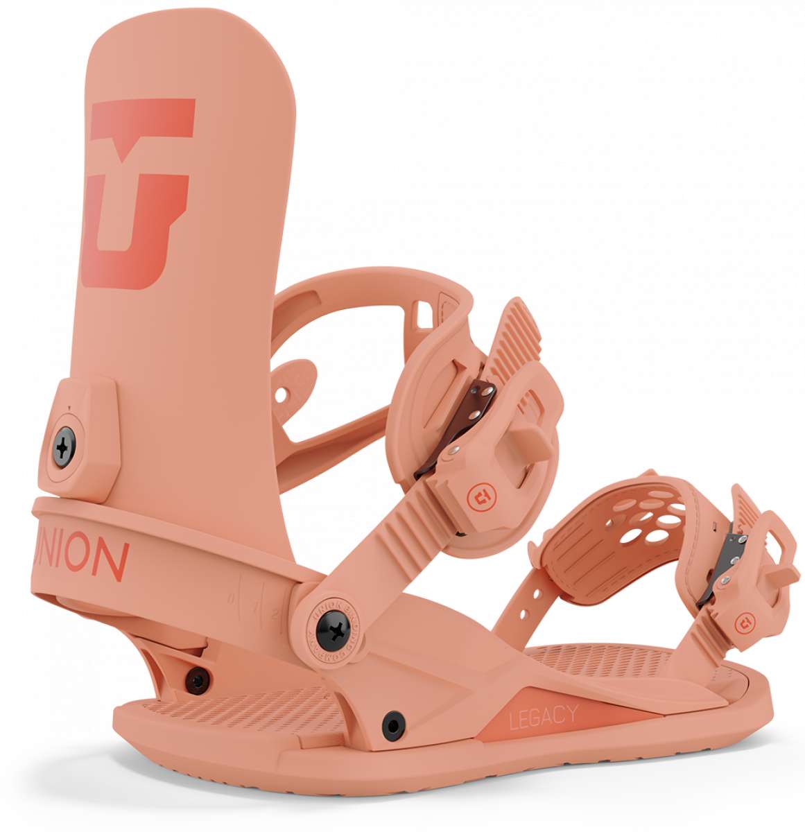 Union Women's Legacy Snowboard Binding 2024 - A salmon-colored snowboard binding with a large "U" logo on top of the footbed and a small red circle with white lettering on the ankle strap.