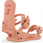 Union Women's Legacy Snowboard Binding 2024 - A salmon-colored snowboard binding with a large "U" logo on top of the footbed and a small red circle with white lettering on the ankle strap.