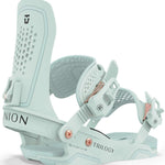 Union Women's Trilogy Snowboard Bindings 2024 - A pair of light blue snowboard bindings with rose gold buckles and a textured footbed.