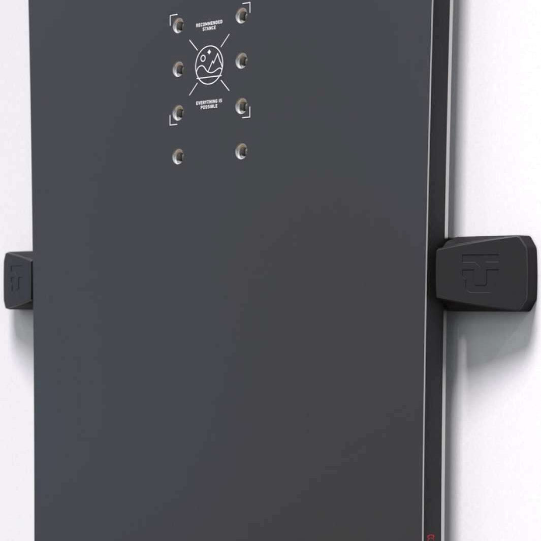 Union Snowboard Wall Mount 2023-2024 - A black metal wall mount with a circular logo and two screws on top, attached to a white background.