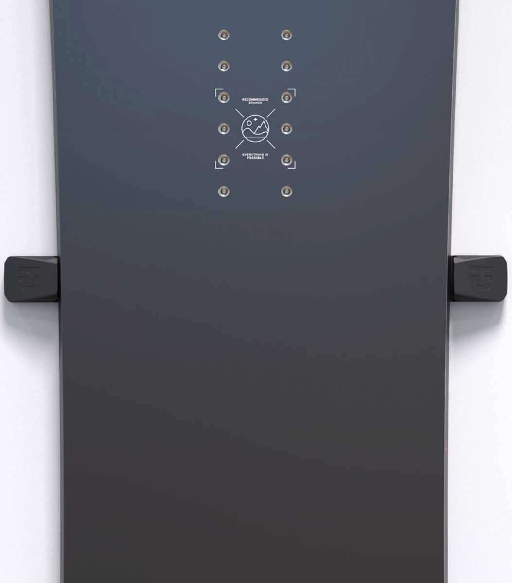 Union Snowboard Wall Mount 2023-2024 - A dark gray wall mount with a circular metal plate and two screws, featuring a minimalist design with clean lines and a subtle logo.