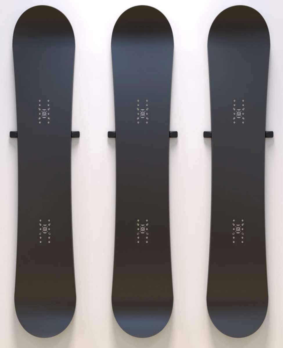 Union Snowboard Wall Mount 2023-2024 - Black metal wall mount with a minimalist design, featuring two horizontal bars and a small logo at the top.