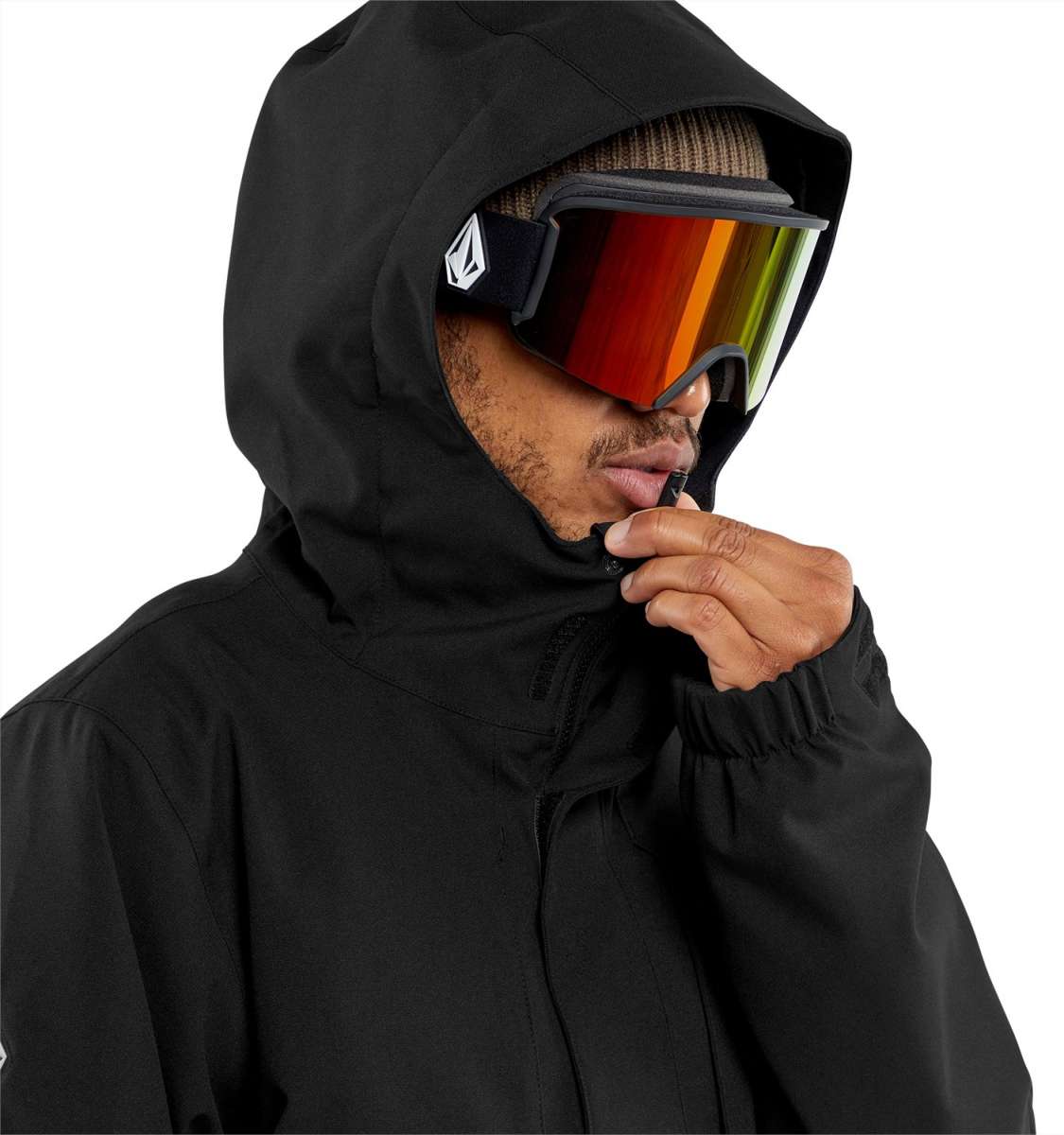 Volcom V.Co Op Shell Jacket 2024 - A black jacket with a hood, featuring a white logo on the left chest and a zippered pocket on the right side.