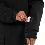 Volcom V.Co Op Shell Jacket 2024 - A black jacket with a white logo on the left sleeve and a white tag near the bottom of the zipper.