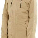 Volcom Women's Fawn Insulated Jacket - A tan-colored jacket with a high collar and zippered pockets, featuring a subtle pattern on the fabric.