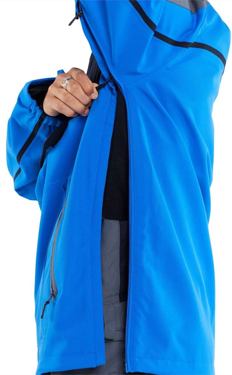 Volcom Brighton Pullover Jacket - A blue jacket with a black zipper on the left side of the chest and two zippered pockets at the bottom.