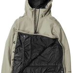 Volcom Brighton Pullover Jacket 2024 - A tan-colored jacket with a hood, featuring a zippered front and two pockets on either side.