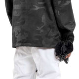 Volcom - A black pullover jacket with a hood, featuring a camouflage pattern on the upper body and sleeves.