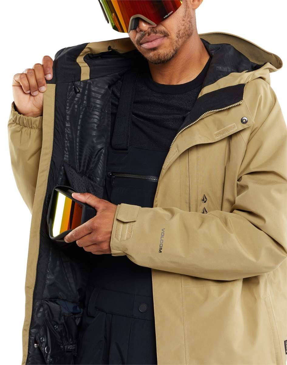 Volcom Dua Insulated GORE-TEX Jacket - A tan jacket with a black zipper and black logo on the left chest, featuring a hood and two zippered pockets.