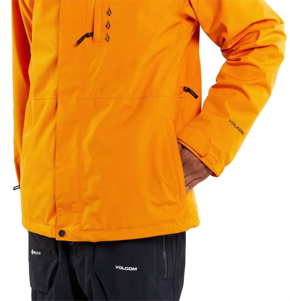 Volcom Dua Insulated GORE-TEX Jacket - A bright orange jacket with a black zipper and black drawstrings on the hood.