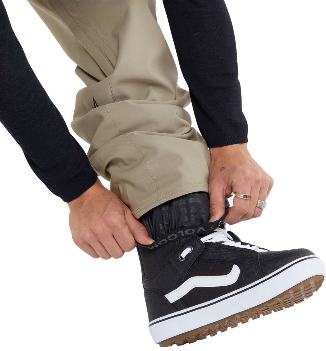 Volcom Freakin' Snow Chino Pants 2024 - Khaki pants with black logo on left thigh and zippered pocket on right side.