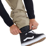 Volcom Freakin' Snow Chino Pants 2024 - Khaki pants with black logo on left thigh and zippered pocket on right side.