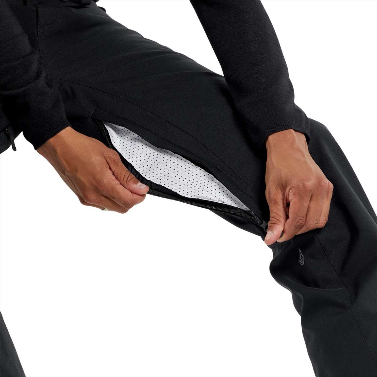 Volcom Freakin' Snow Chino Pants 2024 - Black snow pants with zippered pockets and a white logo on the left leg.