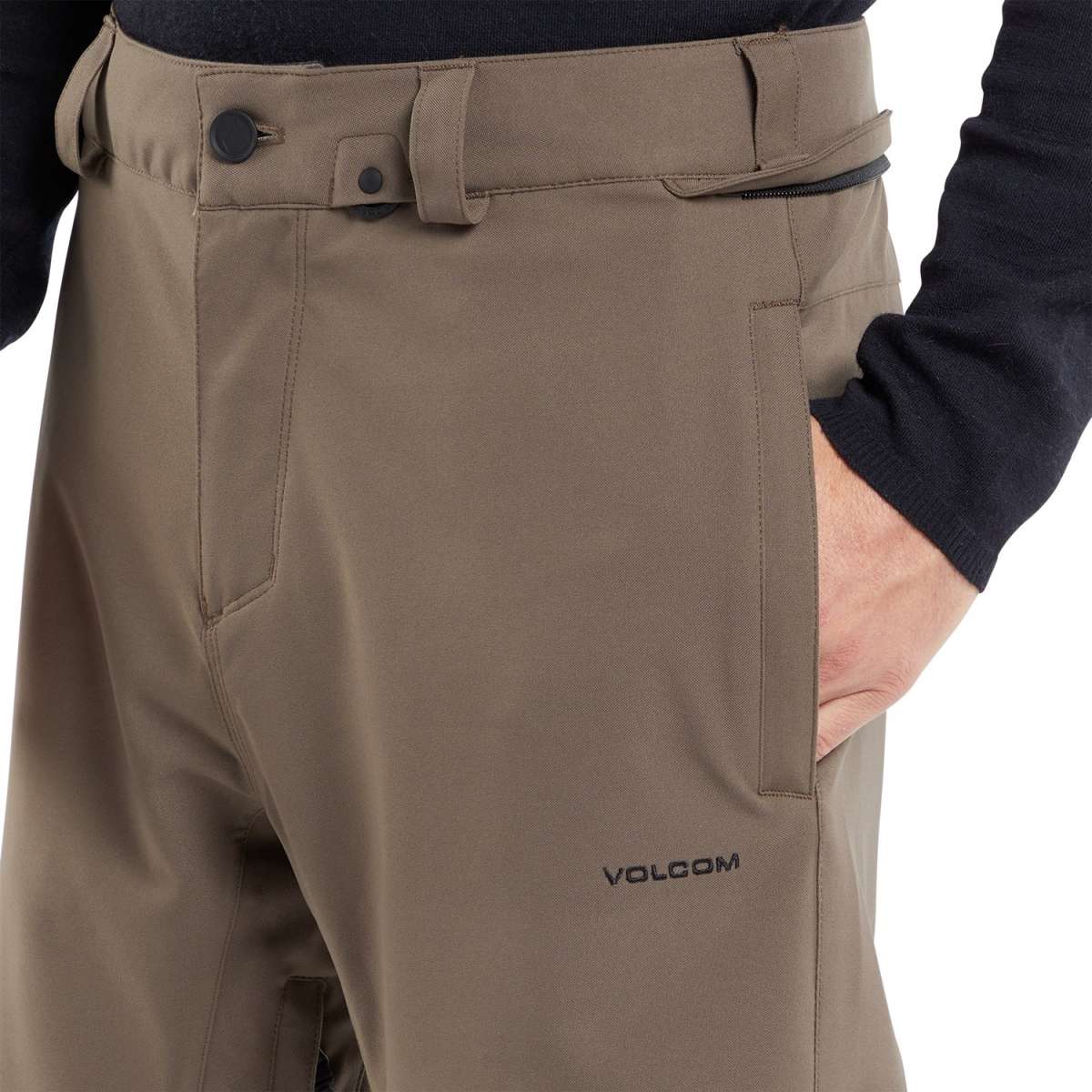 Volcom Freakin' Snow Chino Pants 2024 - Khaki pants with a subtle snowflake pattern on the left leg, featuring a zippered pocket and belt loops.