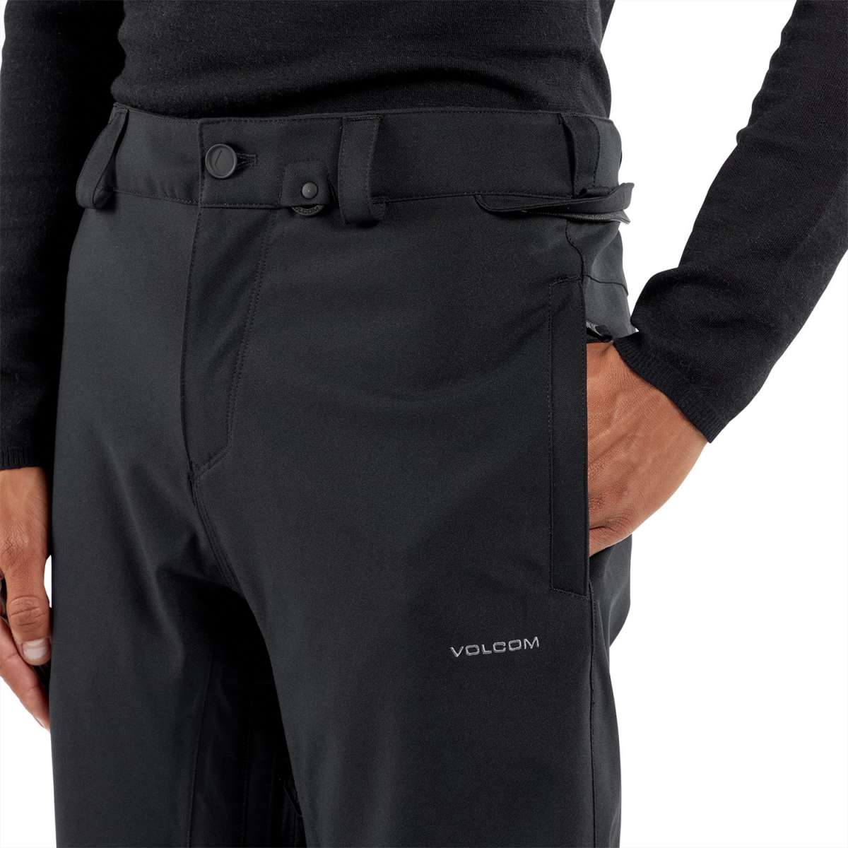 Volcom Freakin' Snow Chino Pants 2024 - Black pants with a subtle white logo on the left thigh and black belt loops.