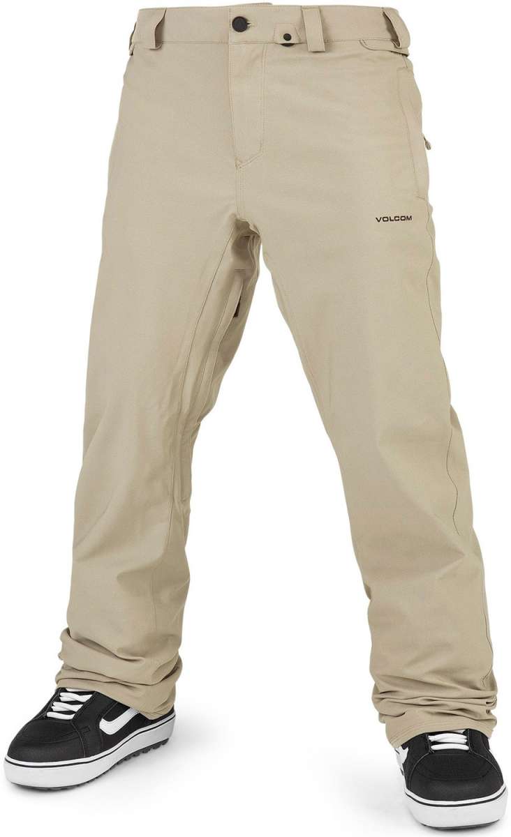 Volcom Freakin' Snow Chino Pants 2024 - Beige pants with a subtle black logo on the left thigh and two zippered pockets at the back.