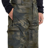 Volcom L GORE-TEX Shell Pant 2024 - A pair of olive green camouflage pants with a zippered pocket on the thigh.