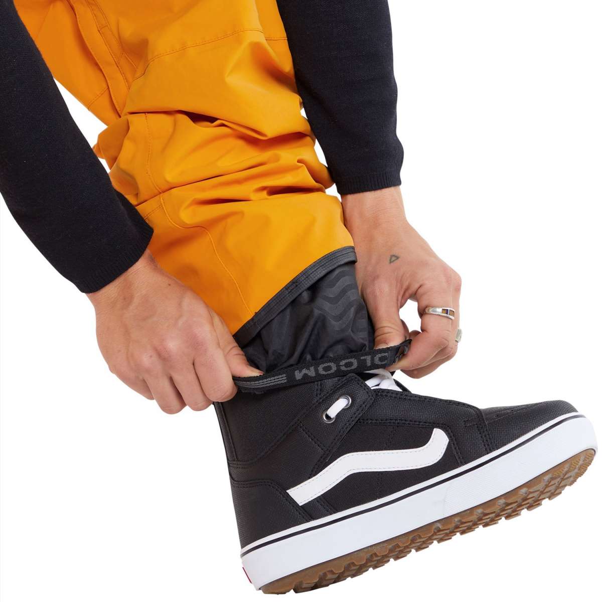 Volcom L GORE-TEX Shell Pant - A pair of yellow snow pants with a black waistband and zipper fly, featuring a white logo on the left thigh.