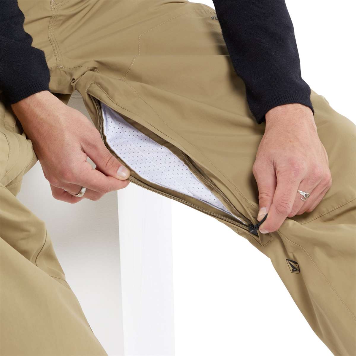 Volcom L GORE-TEX Shell Pant 2024 - Beige pants with a zippered fly and black logo on the left leg.