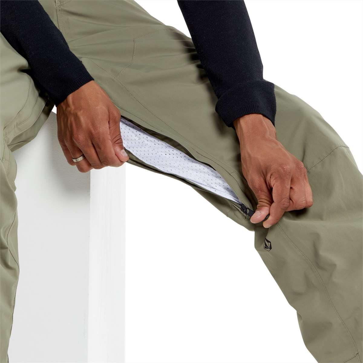 Volcom L GORE-TEX Shell Pant 2024 - A pair of khaki-colored pants with a zippered fly and two front pockets, featuring a GORE-TEX logo on the left leg.