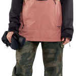 Volcom Women's Ashfield Pullover Jacket - A black, pink, and tan jacket with a hood and zipper closure.