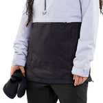 Volcom Women's Ashfield Pullover Jacket - A light blue jacket with a hood and zipper closure, worn by a model on a solid background.