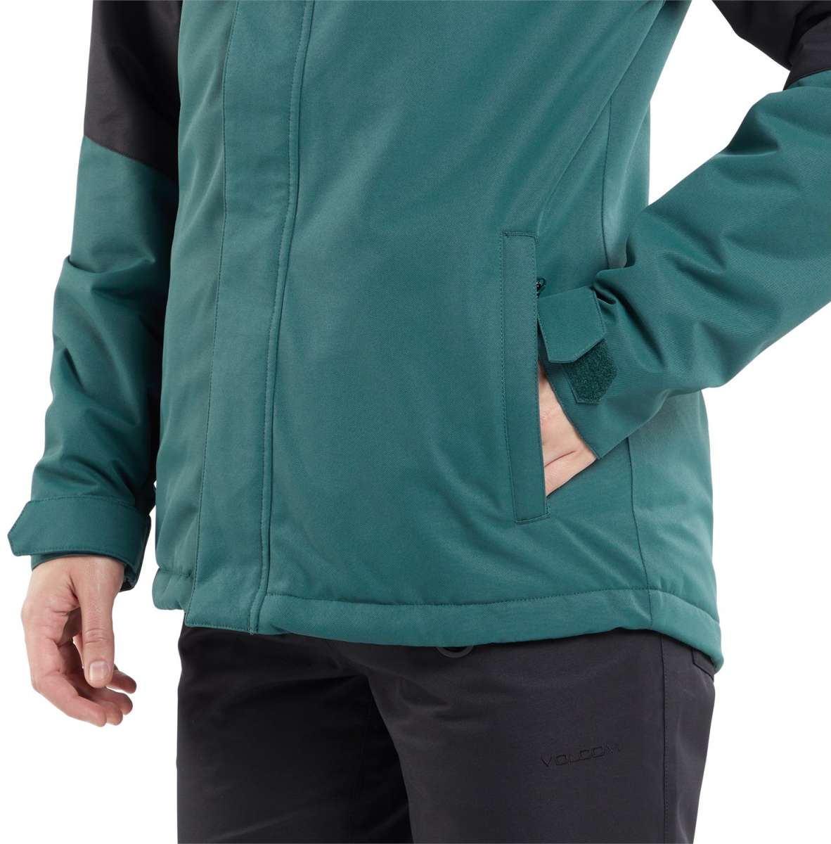 Volcom Women's Bolt Insulated Jacket 2024 - A forest green jacket with black accents on the shoulders and sleeves, featuring a zippered chest pocket.